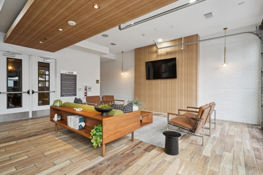 Clubhouse lounge with sofas and TV