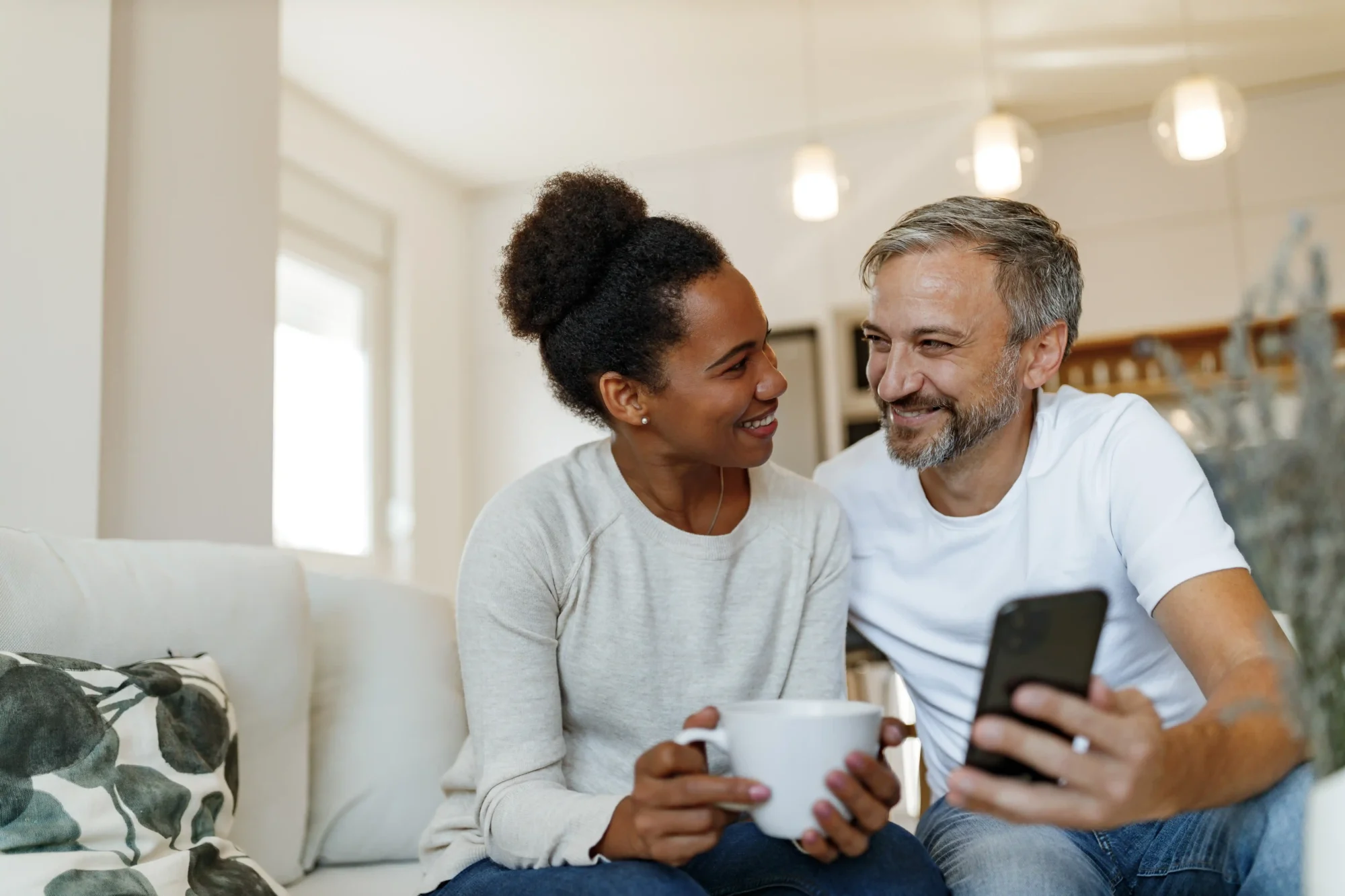 Happy couple looking at a phone